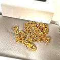 Load image into Gallery viewer, 24K gold filled Figaro chain necklace displayed in a jewelry box on soft gray fabric.
