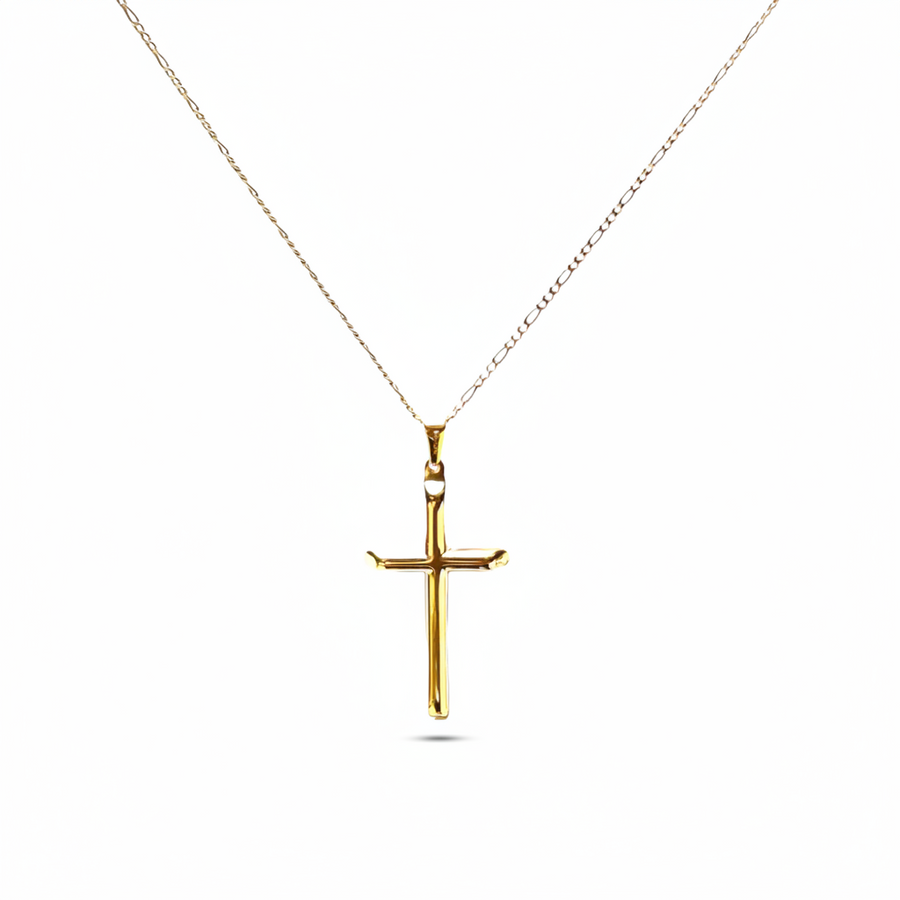 Gold cross pendant on a thin figaro chain against a white background