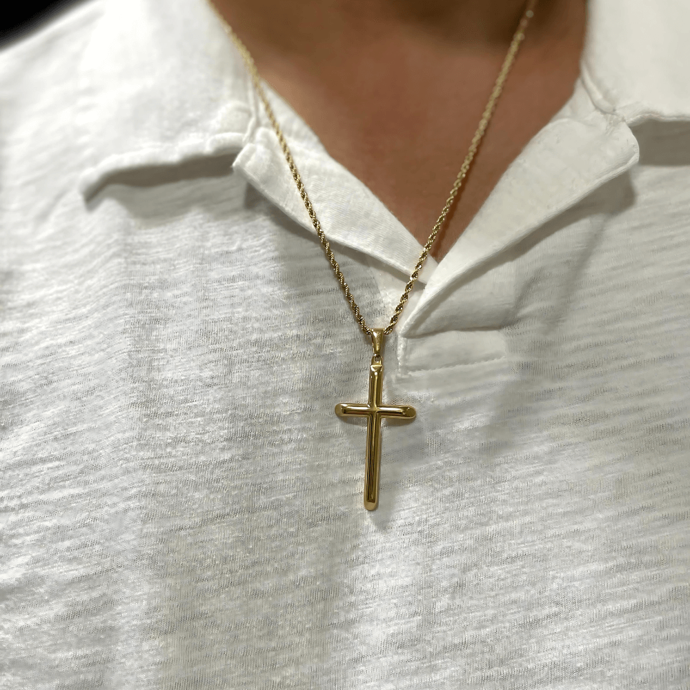 24K gold-filled cross pendant necklace worn on white shirt, showcasing its elegant design and premium craftsmanship.