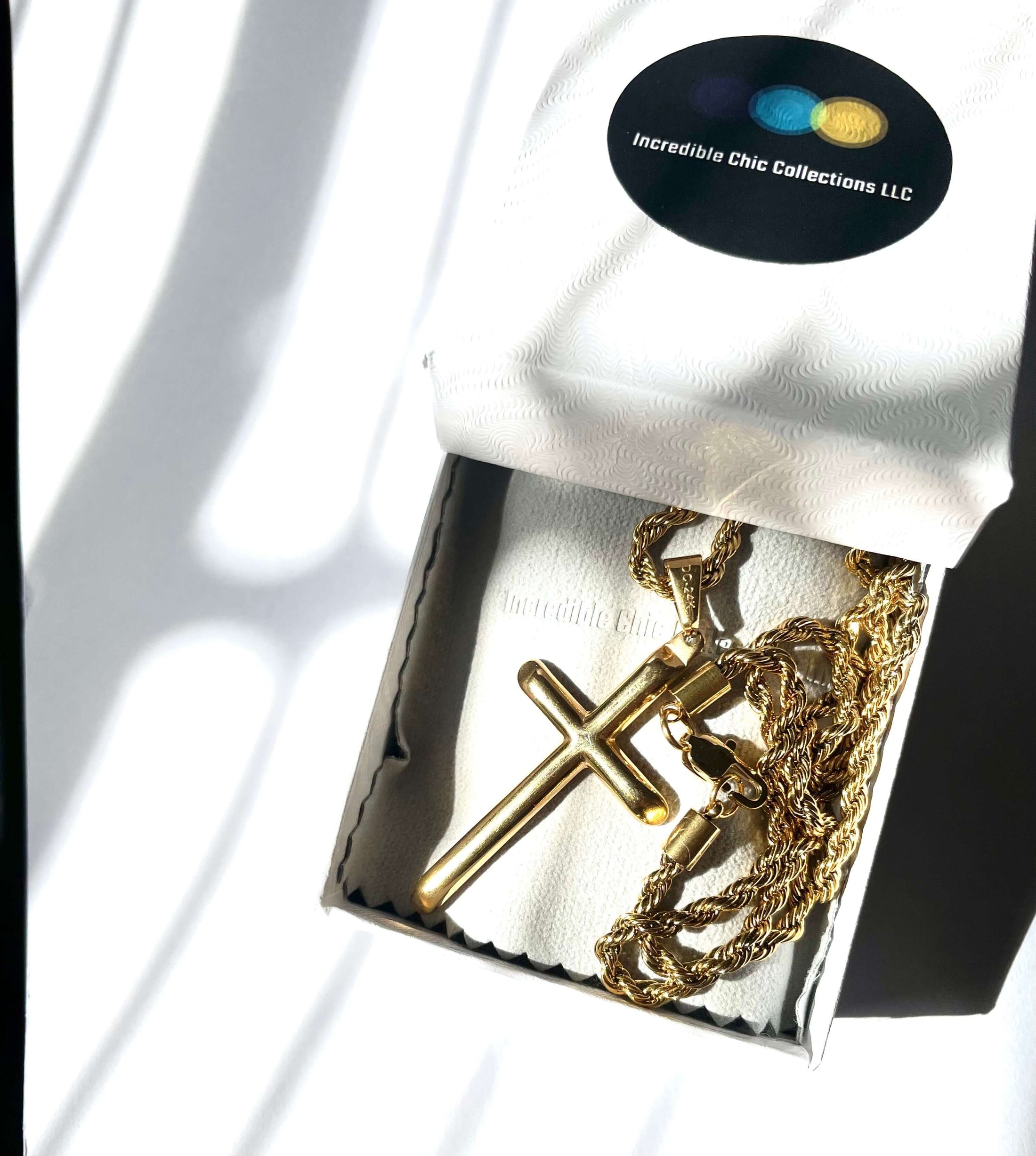 24K gold rope chain cross pendant in elegant packaging by Incredible Chic Collections LLC.
