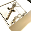 Load image into Gallery viewer, Silver cross pendant necklace displayed in a gift box with soft lining, showcasing elegant craftsmanship.
