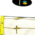 Load image into Gallery viewer, 14k gold cross necklace displayed on a box, featuring a tiny cross pendant and measuring tape for size reference.
