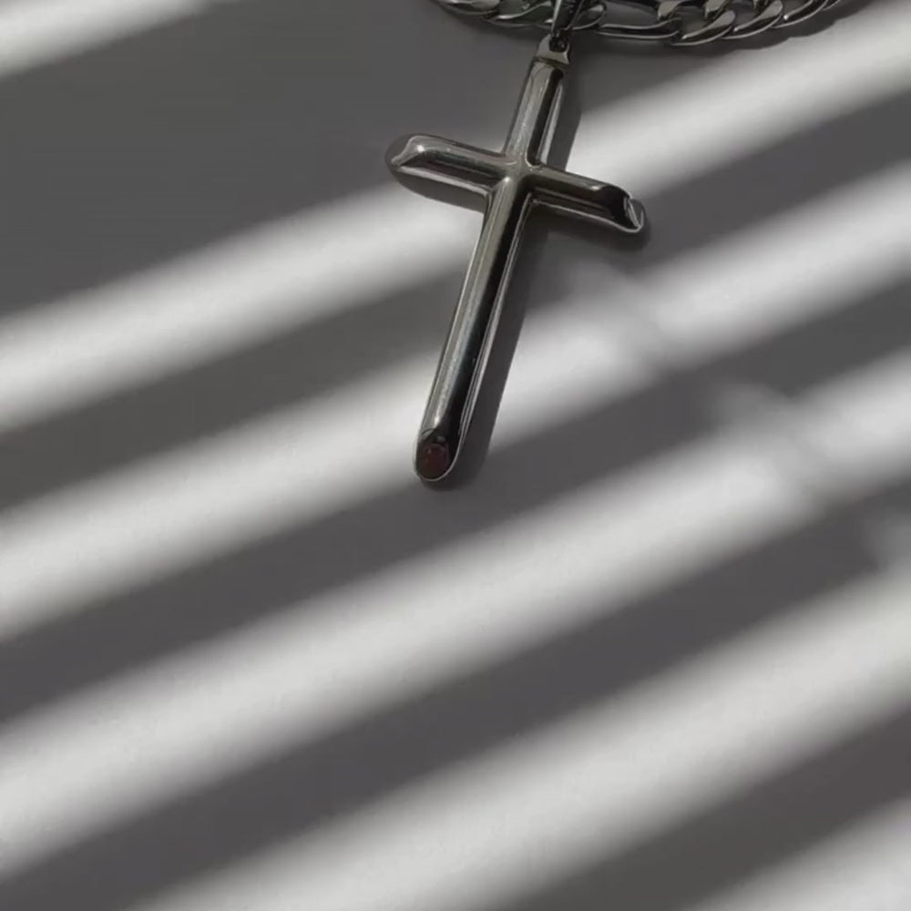 14K white gold Figaro with a cross.